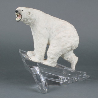 A Franklin Mint figure of a Polar Bear on a clear glass outcrop 14" 