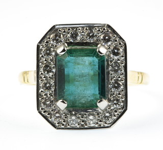 An 18ct gold emerald and diamond rectangular cluster ring, size O 