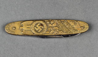 A pen knife bearing a figure of Adolf Hitler