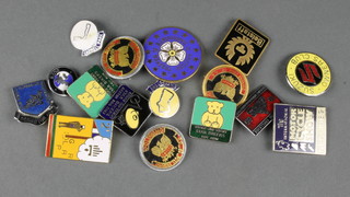 A collection of enamelled motorcycle badges 