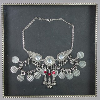 An Arabian repousse necklace with hardstone beads, framed