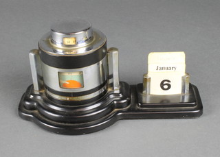 An Art Deco chrome desk barometer and thermometer with calendar 