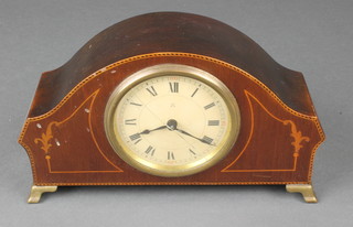 A 1930's bedroom timepiece with enamelled dial and Roman numerals contained in an arched inlaid mahogany case 