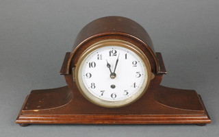 A mantel timepiece with enamelled dial and Arabic numerals contained in a mahogany Admirals hat shaped case 