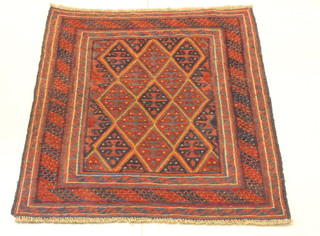 A blue and red ground Gazak rug with all-over diamond design 50" x 44" 