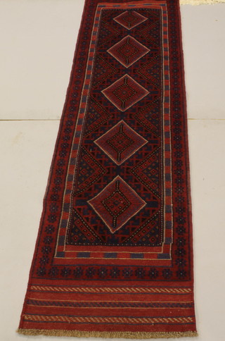 A Meshwani runner with 5 stylised diamonds to the centre 99" x 27"