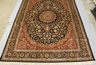 A blue and red ground Persian style rug with medallion to the centre 109" x 78" 