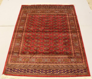 A Bokhara style red ground Belgian cotton rug 76" x 56" 