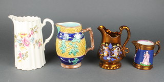 A Victorian lustre jug decorated with a figure of Queen Victoria and Prince Albert 4", another, a Majolica jug and an Edwardian jug 