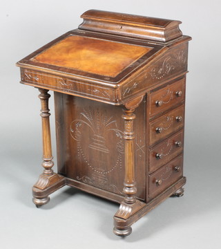 A Victorian carved walnut Davenport desk, the upper section with stationery box with hinged lid and inset leather writing surface, the pedestal fitted 4 long drawers, raised on turned and fluted supports 32"h x 21"w x 21"d 