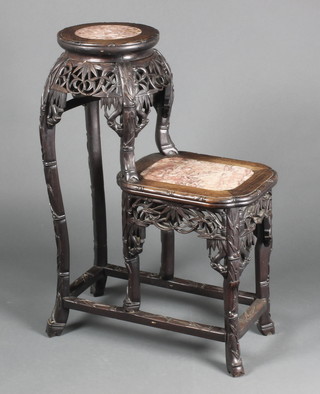 A 19th Century Chinese carved and pierced padouk wood  2 tier jardiniere stand of circular and oval form, raised on turned supports with box stretcher, 34" x 24" x 13" 