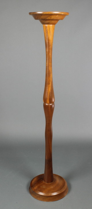 A turned mahogany torchere 47"h x 9 1/2" diam. 