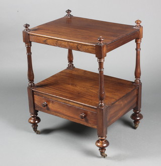 A Victorian rectangular mahogany 2 tier what-not, the base fitted a drawer, raised on bun feet, brass caps and casters 29"h x 22"w x 17"w 