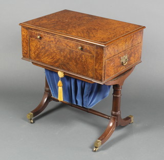 A rectangular figured walnut sewing table, fitted 1 long and 1 short drawer with deep basket to the base, raised on turned supports with H framed stretcher 22 1/2"h x 20 1/2"w x 15"d 