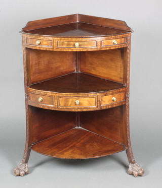 A Georgian mahogany 3 tier corner wash stand with three-quarter gallery fitted 1 long drawer flanked by dummy drawers, raised on lion paw feet 37"h x 26"w x 18"d 