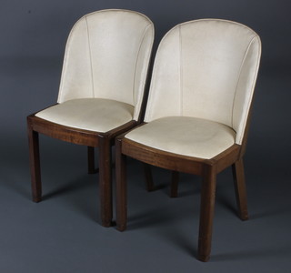 A set of 6 Art Deco walnut tub back dining chairs, the seats and backs upholstered in rexine, raised on square tapering supports 