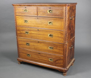 A 19th Century carved camphor military chest, the upper section fitted 2 short and 2 long drawers, the base fitted 2 long drawers with brass counter sunk handles and brass carrying handles to the side 50"h x 44"w x 20"d 