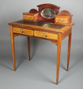 An Edwardian inlaid mahogany writing table with raised mirrored back above 2 short drawers with inset leather writing surface, the base fitted 2 long drawers 37"h x 30"w x 17"d 