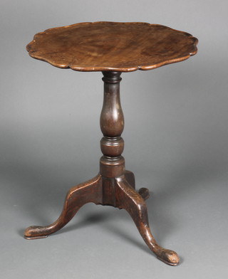 A 19th Century circular mahogany dish top wine table with bracketed border, raised on an associated pillar and tripod base 28"h x 22" diam.  