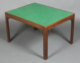 A rectangular mahogany Chippendale style silver table with green baize top raised on square supports and having pierced panels 18"h x 29"w x 22 1/2"d