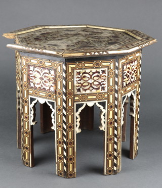 A 19th Century octagonal Moorish, tortoiseshell, ivory and inlaid mother of pearl occasional table 16"h x 18"w 