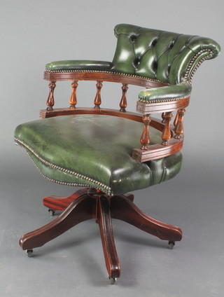 A Victorian style leather and mahogany revolving office chair