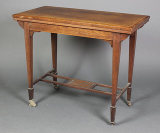 An Edwardian rectangular rosewood card table, raised on square tapered supports with undertier 28"h x 26"w x 18"d 