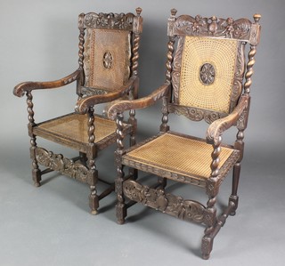 A pair of carved and pierced walnut Carolean style carver chairs with woven cane seats and backs and cresting rails carved eagles, raised on turned and block supports with H framed stretcher  