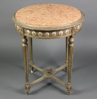 A circular Empire style gilt carved wood occasional table with pink veined marble top, raised on turned and fluted supports with X framed stretcher 30" x 25"diam.