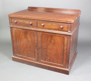 A Victorian mahogany D shaped cabinet with raised back, fitted 2 drawers above a double cupboard enclosed by panelled doors 38"h x 45"w x 27" 1/2"d 