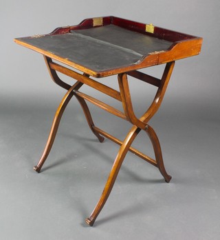 A 19th Century mahogany folding campaign desk raised on X framed supports with turned stretcher 33"h x 24"w x 24"d 