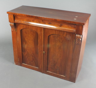 A Victorian mahogany chiffonier fitted a drawer  above a cupboard enclosed by arch shaped panelled doors flanked by scrolls to the sides 31"h x 36"w x 14"d 