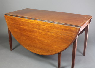 A 19th Century mahogany oval drop flap dining table, raised on 6 square tapered supports 29"h x 53"w x 24" when closed by 68" when opened 