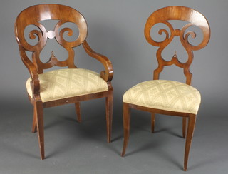 A pierced Biedermeier style carver chair with shaped back and upholstered seat raised on square tapering supports together with a similar standard chair (frame loose) 
