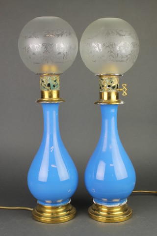 A pair of 19th Century blue glass baluster gilt metal mounted table lamps converted to electricity 14" 