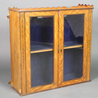A 19th Century inlaid satinwood hanging cabinet, fitted a shelf enclosed by a panelled door 24"h x 25"w x 8 1/2"d 