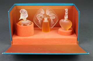 A boxed set of 3 Lalique scent bottles Les Introuvables 