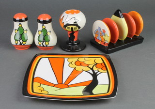 A Lorna Bailey Art Deco style 5 bar toast rack, a pair of condiments egg cup and plate 