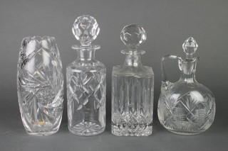 A cut glass spirit decanter and stopper, 2 other decanters and a vase 