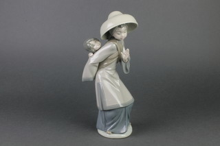 A Lladro figure of a Japanese lady with a child on her back 11" 