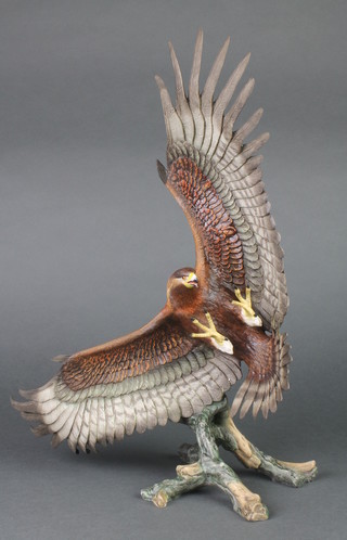 A Franklin Mint figure of an eagle on a tree stump 14" 