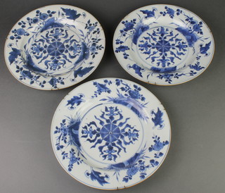 3 18th Century Chinese blue and white plates, the borders with flowers enclosing stylised geometric medallions 11" 