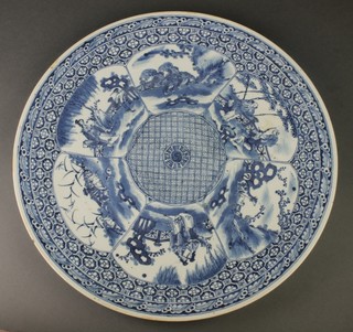 A 19th Century Chinese blue and white charger with panels of figures in pavilion gardens and animals in landscape.  Character mark to base 16 1/4" 