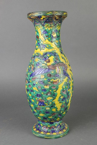 A Chinese provincial green glazed oviform vase with waisted neck, decorated with exotic birds amongst flowers 16"