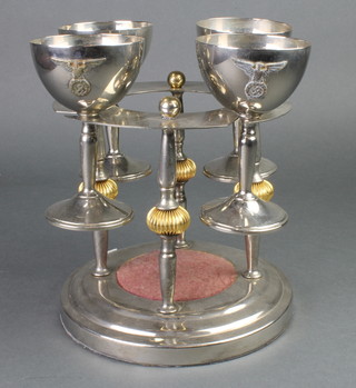 4 silver plated goblets decorated a German eagle on an associated stand 