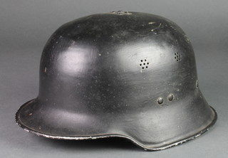 A German style parade steel helmet, some dents  