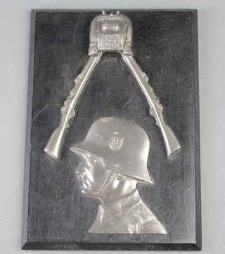 An ebony plaque decorated a marksman 9" x 7"