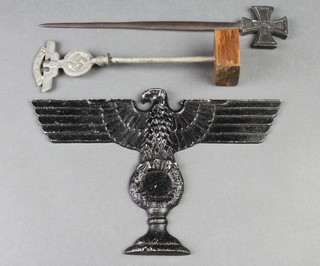 A facsimile paper knife decorated an iron cross, a cast aluminium eagle and a table flag marked NSKK 