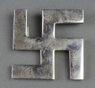 A silvered metal Swastika plaque 3 1/2" 