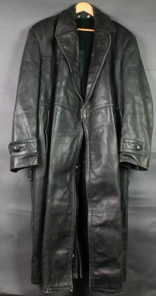 A green leather full length trench coat